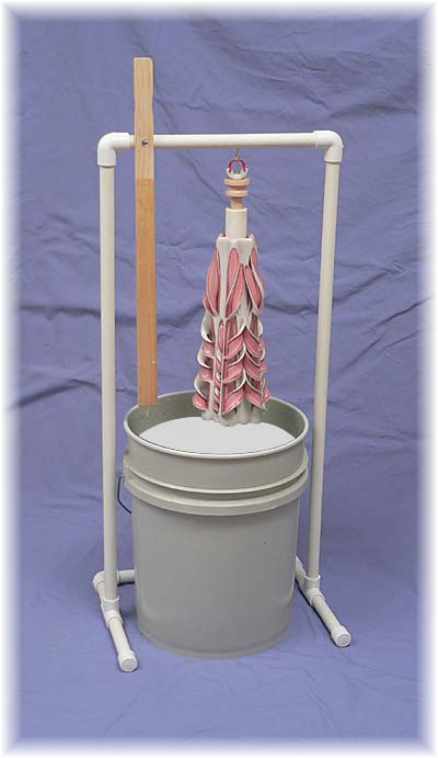 dripping rack with candle over the 5 gallon glaze bucket